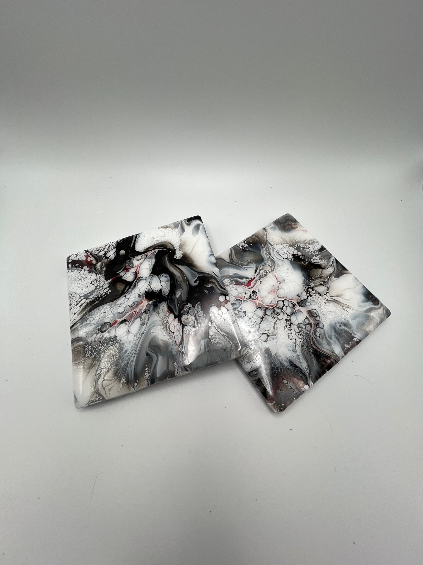 Black And White Coasters With A Touch Of Red Copper