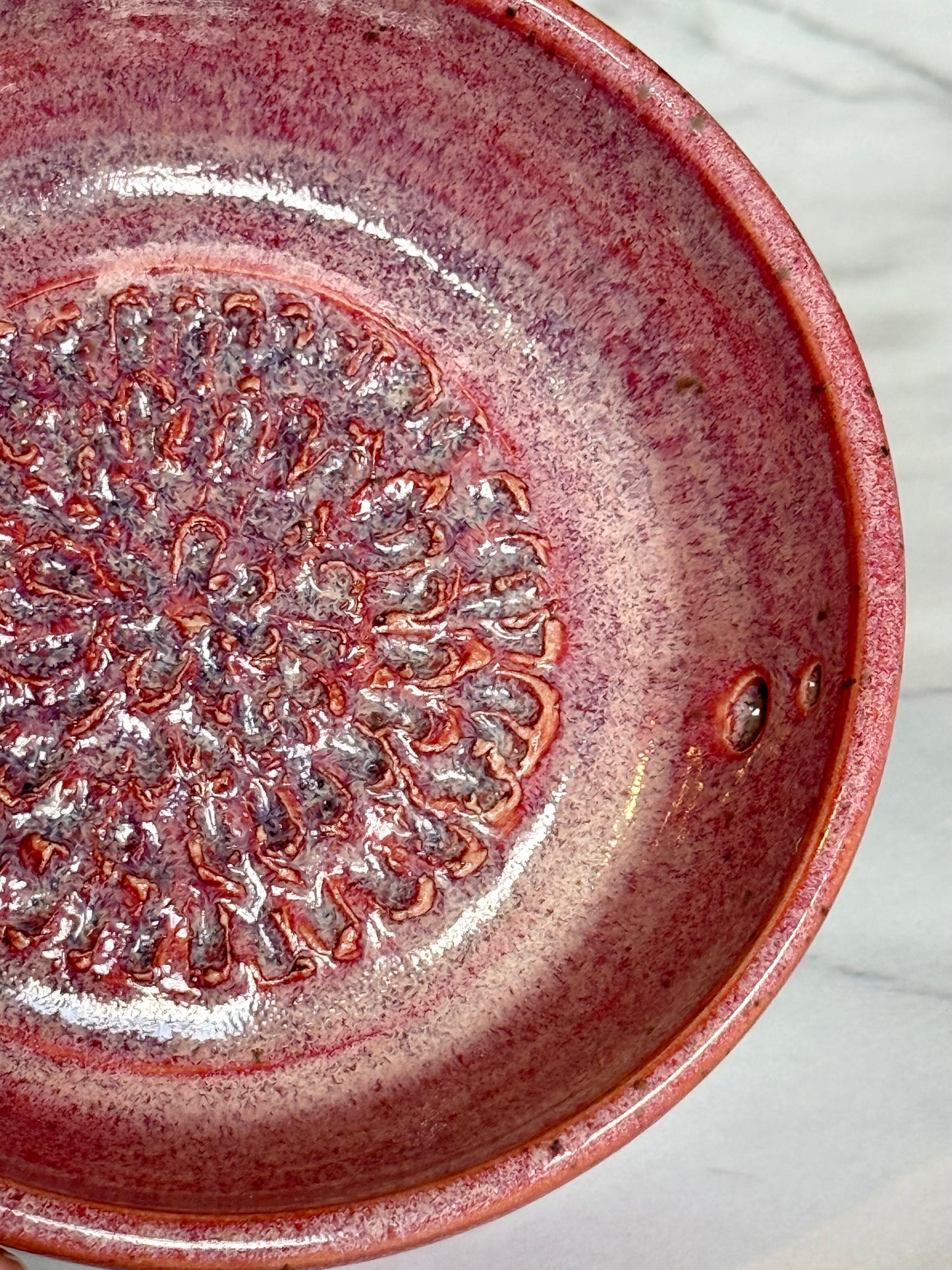 Bright pink garlic grater and herb stripper