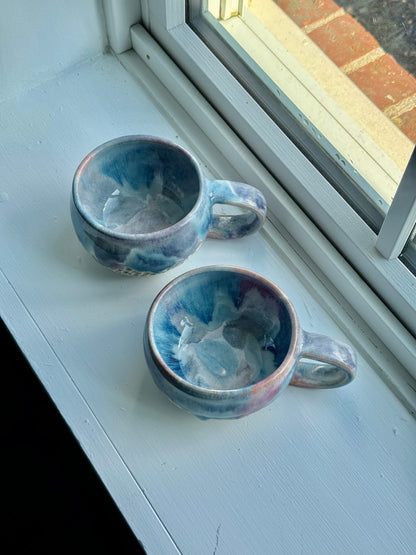 a set of beautiful drippy mugs