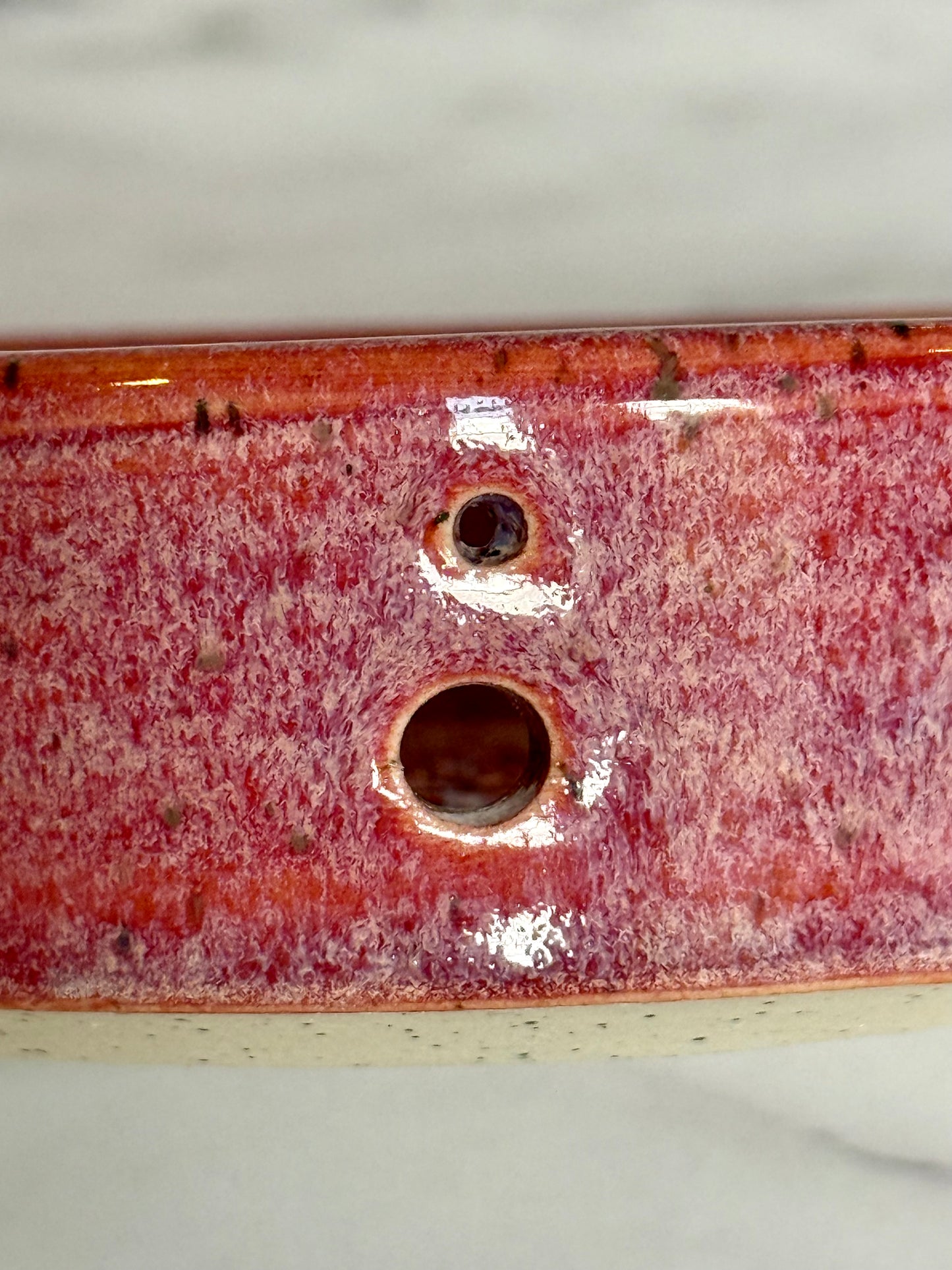 Bright pink garlic grater and herb stripper